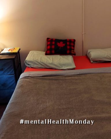 image of a freshly-made bed; text reads MentalHealthMonday